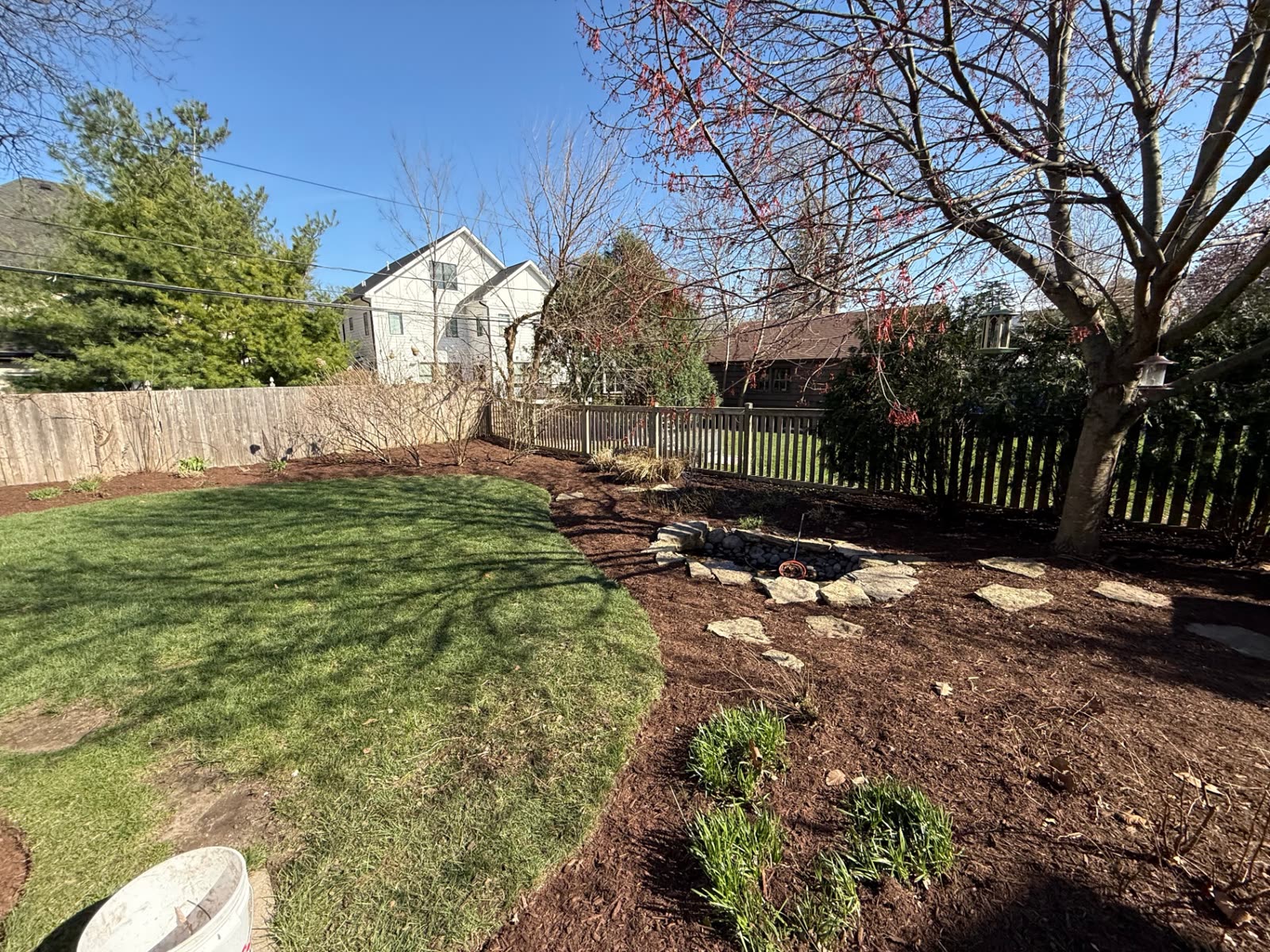Flagstone path leading to a stone fire pit