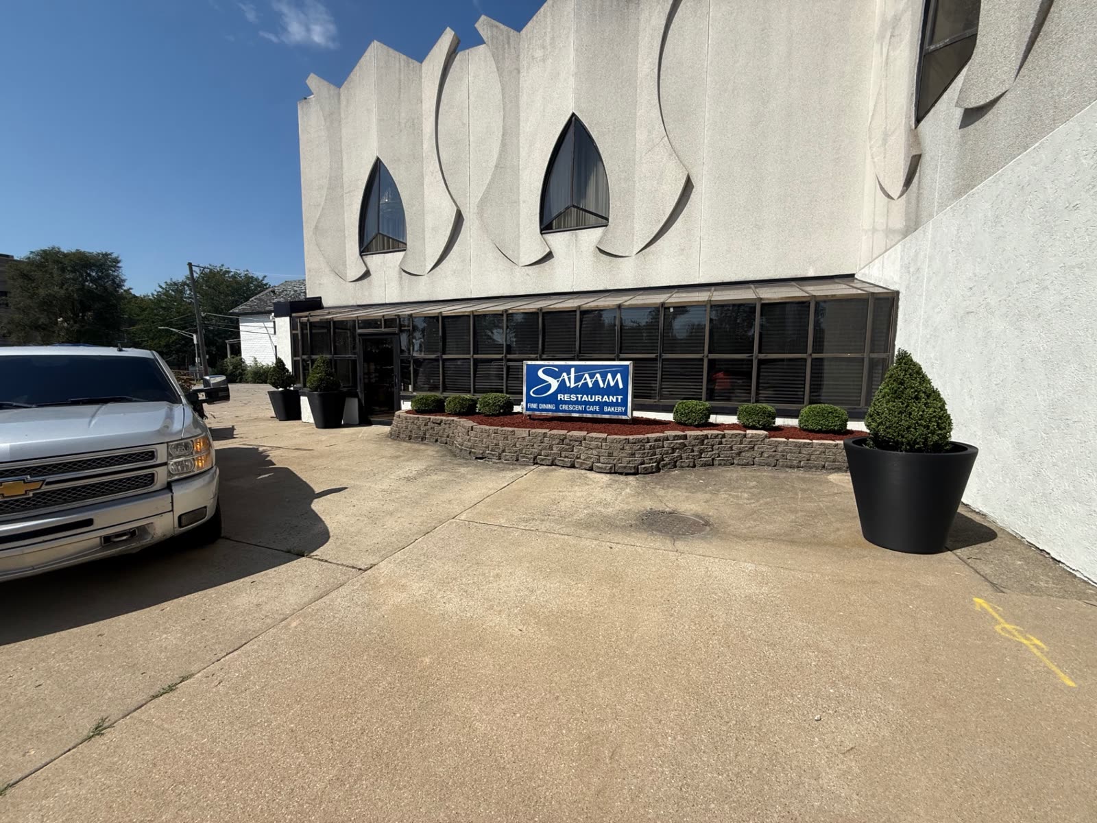 Commercial building frontage with maintained planter bed