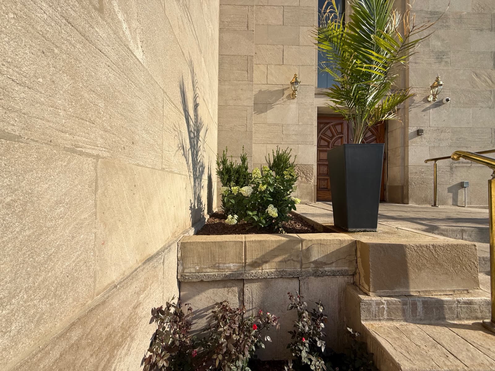 Stone planters flanking an entrance stairway
